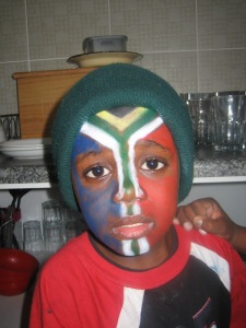 A South African child sports his country's colors